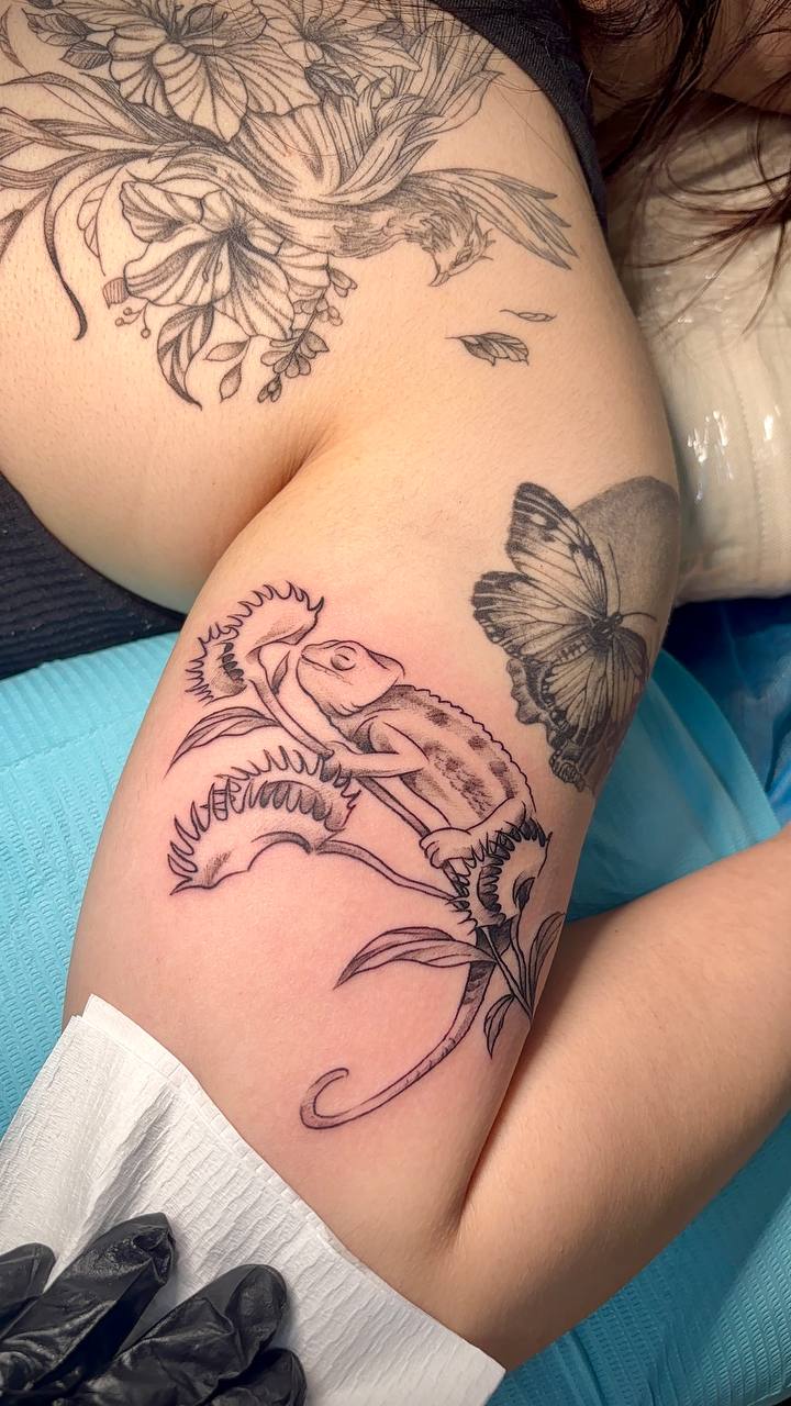 Botanical chameleon tattoo by Lydia